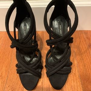 Black high heels sandals.